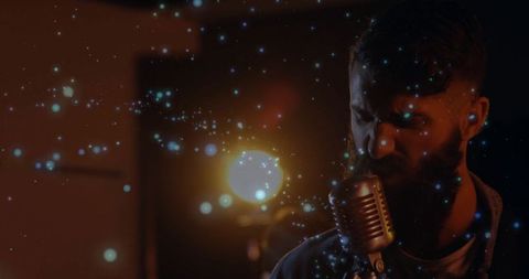 Moody Vocalist Performing into Retro Microphone with Sparkling Ambiance