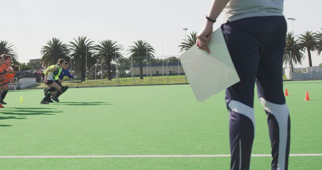 Field Hockey Coach Supervising Players During Practice Drills - Download Free Stock Images Pikwizard.com