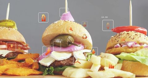 Gourmet Mini Burgers with Digital Data Overlays Displaying Sustainability