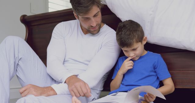 Father Reading with Son at Home in Cozy Setting - Download Free Stock Images Pikwizard.com