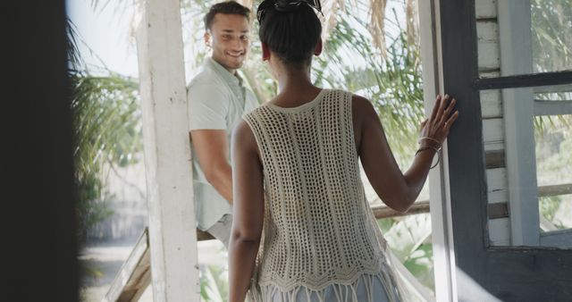 Woman Entering Tropical House Greeting Smiling Man - Download Free Stock Images Pikwizard.com