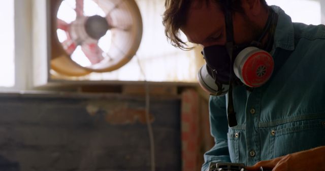 Surfboard Maker Wearing Respirator Working in Workshop - Download Free Stock Images Pikwizard.com