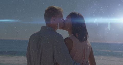Romantic Couple Kissing on Tranquil Seaside at Twilight