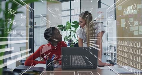 Women Collaborating with Data Overlays in Modern Office Environment