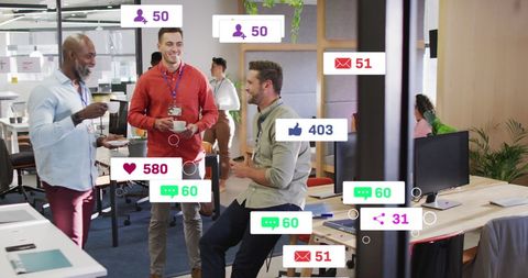 Diverse office creatives engage during break with social notifications