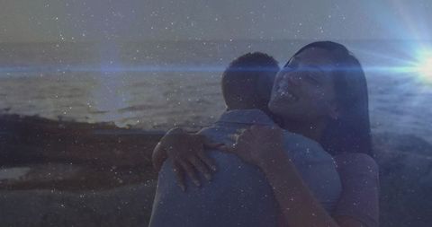 Romantic Embrace at Sunset on Tranquil Shoreline