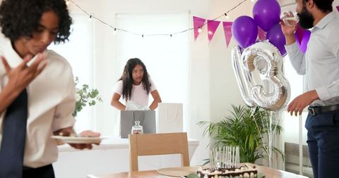 Family Celebrating at Home Following a Birthday Party