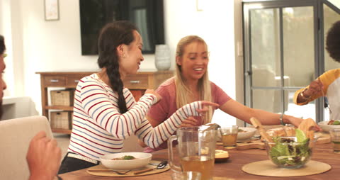 Diverse Friends Enjoying Mealtime in Modern Home