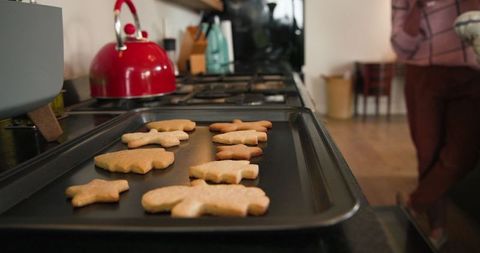 Freshly Baked Shaped Cookies on Tray in Cozy Home Kitchen