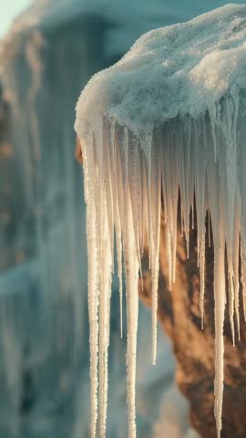 Sunlight Sliding Across Snowy Ledge, Icicles Swaying and Dripping Meltwater