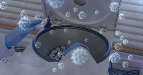 Scientist Using Centrifuge for COVID-19 Research with Virus Graphics