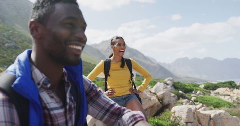 Cheerful African American Couple Hiking in Scenic Mountain Terrain