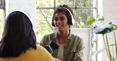 African american female professionals recording podcast