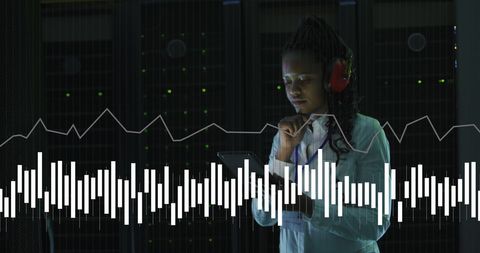 IT Engineer Managing Data with Abstract Graph Overlay in Server Room - Download Free Stock Images Pikwizard.com