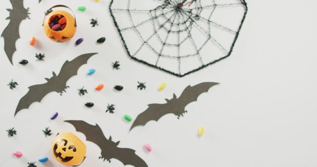 Creative Halloween Theme On White Background With Bats Pumpkins And Candy - Download Free Stock Photos Pikwizard.com