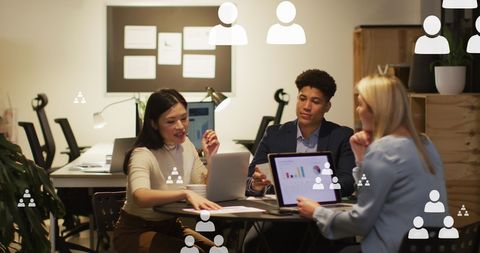 Diverse team analyzing social media data in modern office