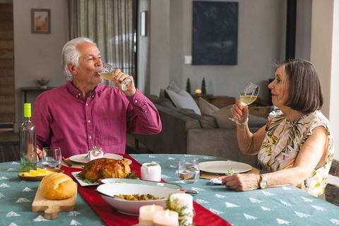 Senior Couple Enjoying Elegant Home Dining Experience