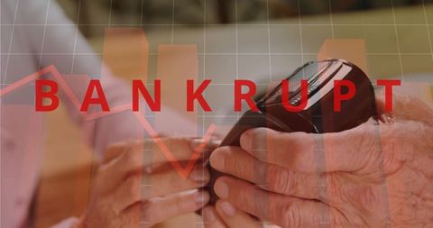 Elderly hands managing mobile payment and wallet while bankrupt alert showing financial strain