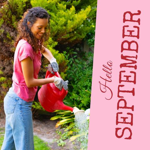 Joyful woman watering garden in autumn