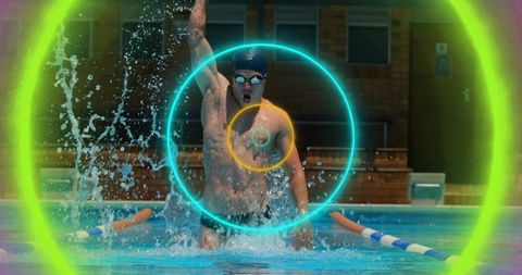 Energetic swimmer breaking water surface with vibrant rings