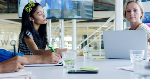 Diverse Team Collaborating During Virtual Meeting in Modern Office