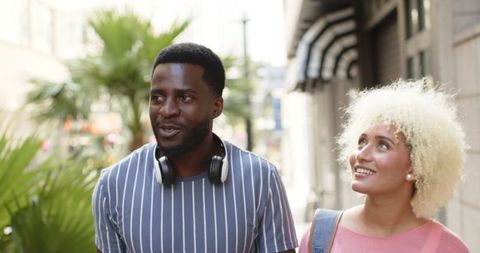 Diverse Couple Enjoying City Walk Together