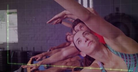 Group fitness class in action at gym studio