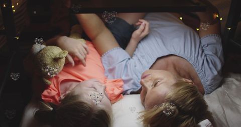 Caucasian Mother and Daughter Sharing Tender Bedtime Moment