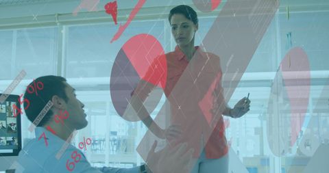 Business Professionals Analyzing Data Projections on Transparent Screen