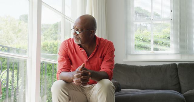 Senior Man Pondering While Sitting on Couch at Home - Download Free Stock Images Pikwizard.com