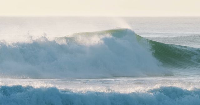 A powerful wave crests beautifully as it breaks, showcasing the raw energy of the ocean - Download Free Stock Photos Pikwizard.com