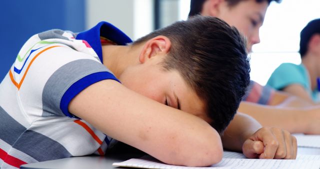 Tired student sleeping in classroom at school - Download Free Stock Photos Pikwizard.com