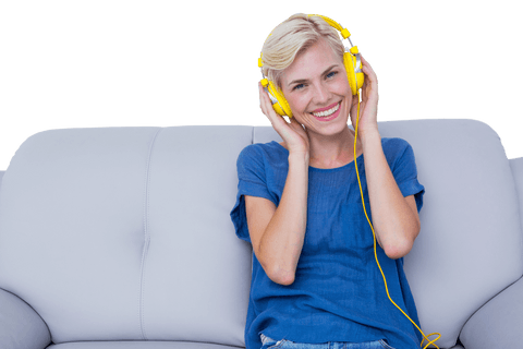 blonde woman relaxing on couch with music and yellow headphones, transparent background - Download Free Stock Videos Pikwizard.com