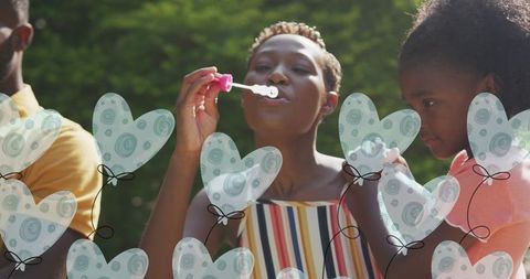 Joyful Family Playing with Bubbles in Sunny Garden