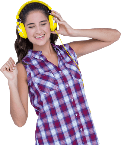 Joyful Brunette in Plaid Shirt Listening to Music with Yellow Headphones Transparent