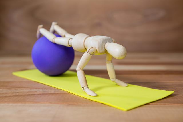 Conceptual image of figurines performing stretching exercise