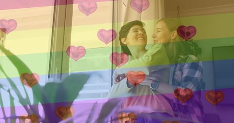 Loving LGBTQ+ Couple Embracing with Rainbow and Hearts Overlay