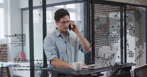 Businessman Engaged in Financial Data Processing at Office Desk