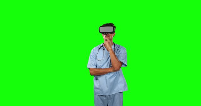 Doctor wearing VR headset while thinking, green screen background used for replacing with custom content. Suitable for use in technology and medical training contexts, illustrating healthcare innovation, or adding interactive elements in health education videos and presentations.