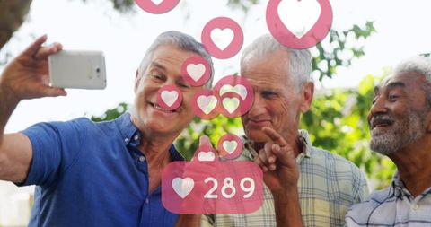 Senior men enjoying selfie with social media engagement icons
