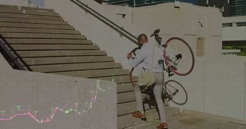 Professional climbing stairs with bicycle, navigating urban challenges