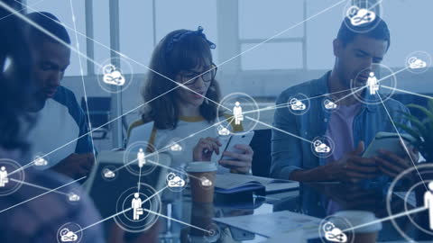 Diverse Professionals Innovating Through Digital Connectivity in Modern Office