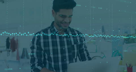 Smiling Businessman Analyzing Financial Data in Office