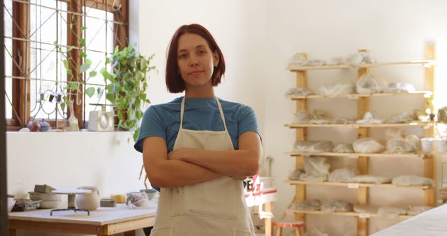 Confident Female Pottery Artist Standing in Workshop - Download Free Stock Images Pikwizard.com