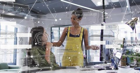 Young professionals collaborating in modern office with digital network overlay, teamwork