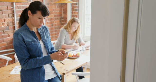 Women Working and Using Smartphone in Modern Home Office - Download Free Stock Images Pikwizard.com