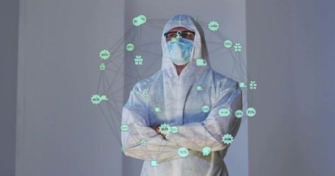 Lab technician wearing full ppe viewing augmented reality network of medical supply icons