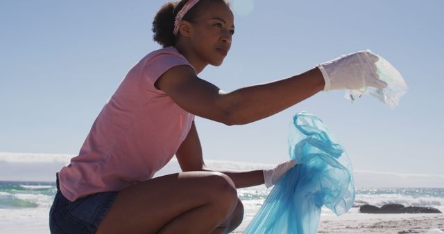 Dedicated Volunteer Cleaning Beach Holding Plastic Waste - Download Free Stock Images Pikwizard.com