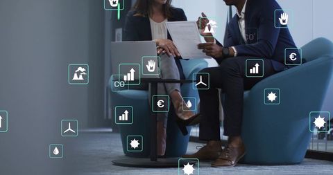 Business leaders reviewing sustainability report in office lounge with analytics icons