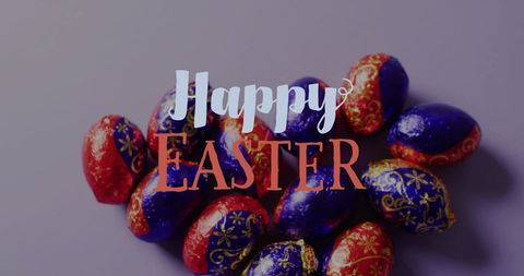 Colorful easter eggs and happy easter text on pastel background